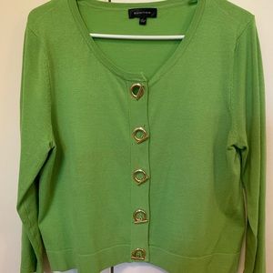 Lime green cardigan w/ accent buttons.